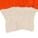 A close up of orange and white knitted Cordova work gloves.