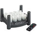 A white Sterno flameless candle set on a black EasyStack charging base with a remote control.