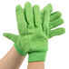 A pair of lime green Cordova jersey gloves with double palm.