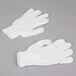 A pair of Cordova white polyester work gloves.
