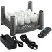 A group of white Sterno flameless candles with a black EasyStack charging base and a remote.