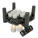 A black rectangular Sterno EasyStack charging base with white Sterno flameless tea lights and remote.