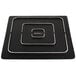 A square matte black stoneware plate with silver trim on a counter.