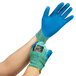 A pair of blue Cordova iON heavy duty work gloves with a blue crinkle latex palm coating.