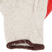 A close up of a Cordova knitted work glove with red latex coating.