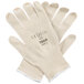 A pair of white Cordova Natural Cotton Work Gloves with blue nitrile coating on the palms.