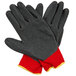 A pair of red gloves with dark gray latex coating and yellow accents.