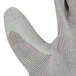 A close up of a medium Cordova warehouse glove with a gray crinkle latex palm coating.