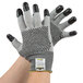 A pair of Cordova Monarch cut resistant gloves with two-sided black nitrile dotted coating.