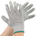 A pair of large Cordova grey and green gloves with latex palms.