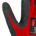 A pair of red nylon gloves with dark gray crinkle latex coating on the palm and black accents.