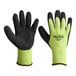 A pair of Cordova Hi-Vis green gloves with black foam latex coating and yellow trim on a white background.