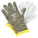 A pair of Cordova Camo Cut Resistant work gloves with yellow tips.