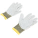 A pair of Cordova camo work gloves with yellow and white trim on a white surface.