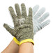 A pair of Cordova camo work gloves with yellow and grey trim on a white background.