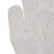 A close up of a Cordova polyester and cotton work glove with black PVC coating on the palm.