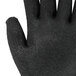 A close-up of a Cordova Monarch cut resistant glove with a black foam latex palm.