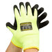 A pair of Cordova Monarch Sub-Zero Hi-Vis green gloves with black foam latex palms over a white background.