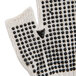 A close up of a Cordova fingerless glove with black dots on a white background.