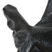 A close up of a black hand wearing a Cordova PVC etched glove.