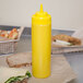 Choice 24 oz. Yellow Wide Mouth Squeeze Bottle - 6/Pack Main Thumbnail 1