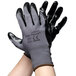A pair of Cordova gray gloves with black nitrile palms.