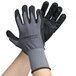 A pair of Cordova gray warehouse gloves with black foam nitrile and nitrile dots on the palms.