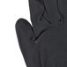 A close-up of a pair of Cordova black nylon gloves with black foam nitrile/polyurethane coating.