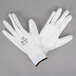 A pair of white Cordova warehouse gloves with white polyurethane palms.