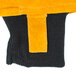 A close up of a Cordova yellow and black freezer mitten with stitched fabric.