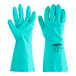 A green Cordova nitrile glove with flock lining on a hand.