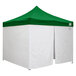 A white tent with a green top.