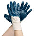 A pair of blue Cordova Smooth Supported Palm Coated Nitrile gloves.