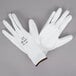 A pair of Cordova white polyester gloves with white polyurethane palm coating.