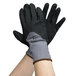 A pair of extra large Cordova black and grey gloves with black foam nitrile and polyurethane palms.