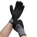 A pair of large Cordova warehouse gloves with black and grey designs.