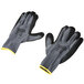 A pair of Cordova gray and yellow grip gloves with black sandy nitrile coating.