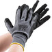 A pair of gray Cordova Cor-Touch gloves with black sandy nitrile palm coating.