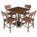 A Lancaster Table & Seating solid wood dining table with a live edge and four wood chairs.
