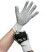 A pair of Cordova OGRE-CR gloves with a grey palm coating. One hand is wearing a grey glove.