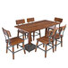 A Lancaster Table & Seating wooden dining table with chairs around it.