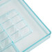 A clear plastic tray with square compartments.