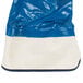 A blue and white bag of Cordova Brawler Smooth Supported Nitrile Gloves with a blue and white cloth inside.