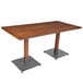 A Lancaster Table & Seating bar height table with a wooden live edge and a metal base.