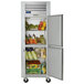 A Traulsen reach-in refrigerator with right hinged doors full of food.