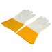 A pair of yellow leather gloves with russet leather cuffs.