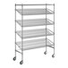 A chrome Regency wire shelving unit with angled shelves and wheels.