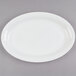 A white oval Fineline plastic cater tray.