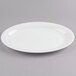 A Fineline white plastic oval catering tray with a rim.