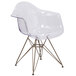 A Flash Furniture Alonza clear polycarbonate side chair with gold legs.